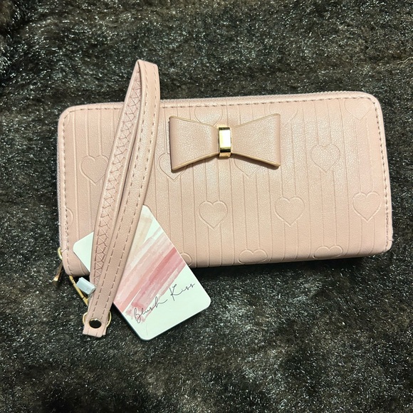 Handbags - Unbranded cream colored long wallet w/ a bow on the front, 2 zipper compartments